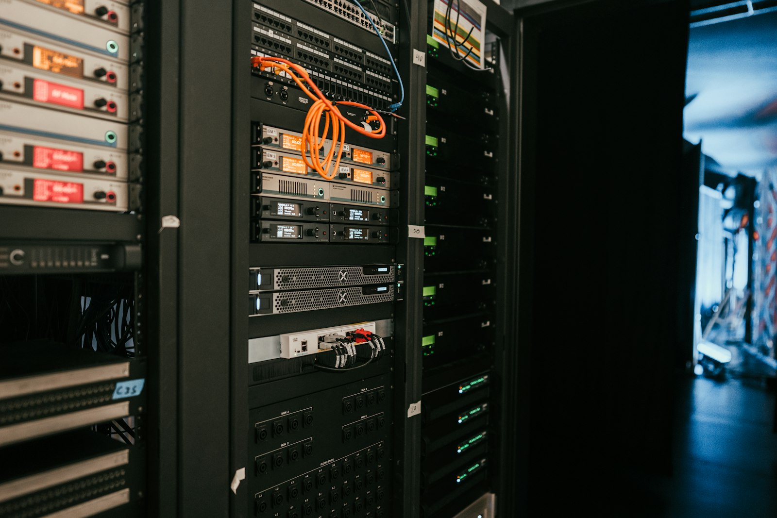 Rows of servers in a data centre, representing the data sovereignty and cybersecurity infrastructure discussed at the Caribbean AI Forum